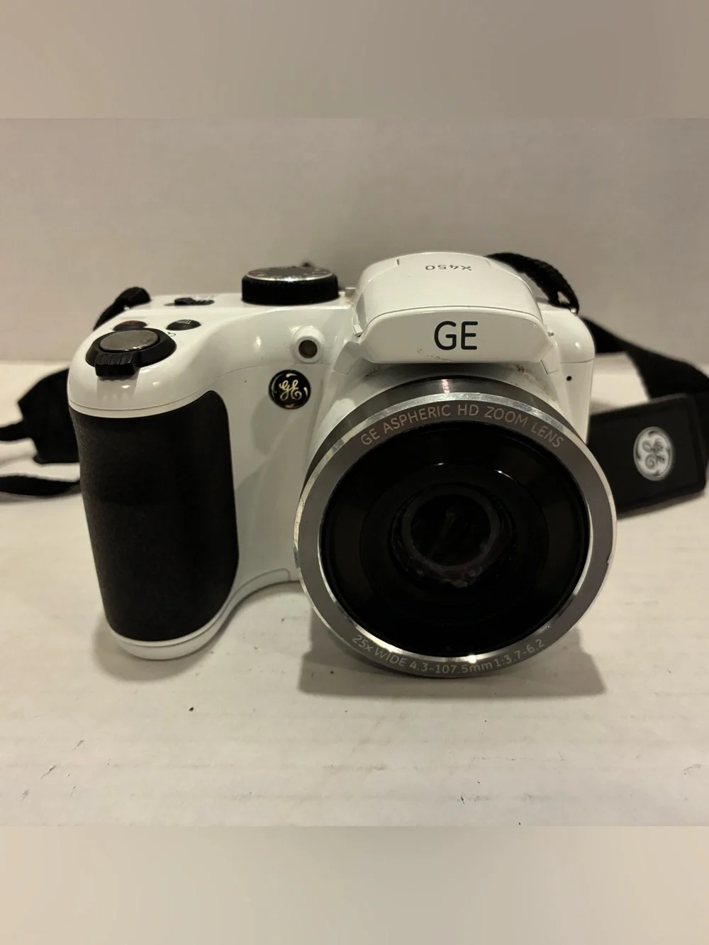 GE Digital Camera x450.  It is white and take very good pictures.